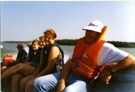 Walter and youth in motorboat