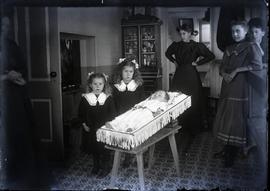 Interior funeral shot - Bergen child in coffin