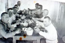 Group of men from forestry service sitting at a table together