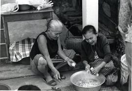 Laotian women preparing food