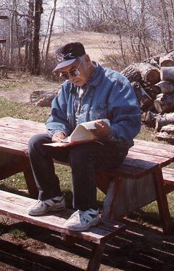 Man reading on picnic table