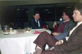 Delbert Plett, Al Friesen, Bert Friesen sitting at a table
