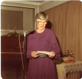 A woman giving a speech. 1982