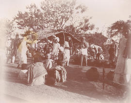 People standing near shed in Indian village