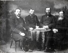 Four ministers seated around a table in Kuban