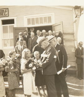 Girls giving flowers to Sir Edward Beatty