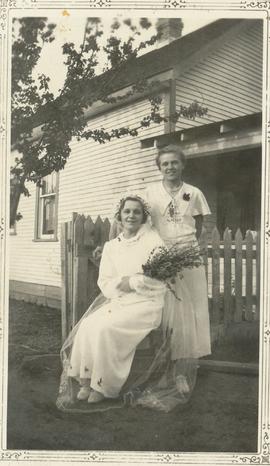 Bride Anne Dyck with bridesmaid