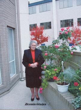 Elfrieda Friesen with flowers