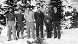Six men in formal dress pose at Montreal River Camp